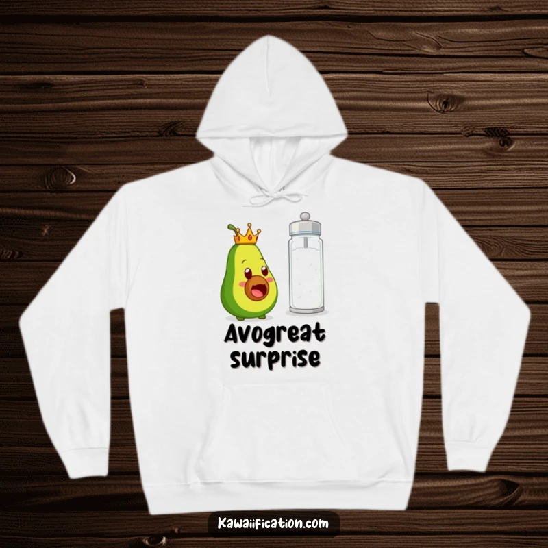 Funny hoodie print of a regal avocado character looking astonished by a massive salt shaker, creating a humorous scene of unexpected culinary drama.