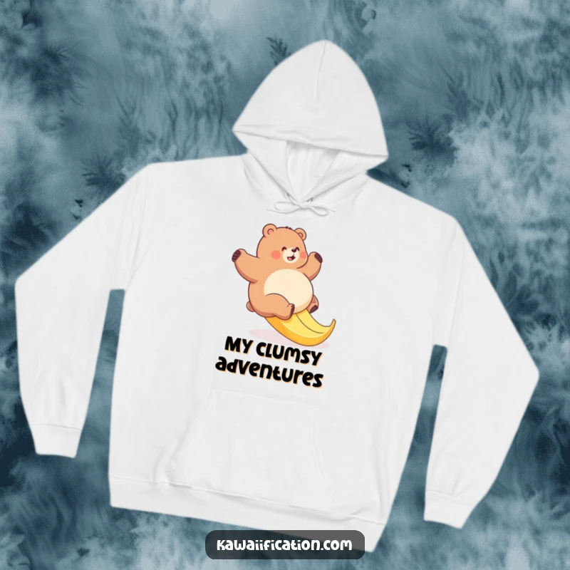 Funny bear hoodie featuring a plump bear comically attempting to ascend a slick banana peel, perfect for cozy, humorous wear.