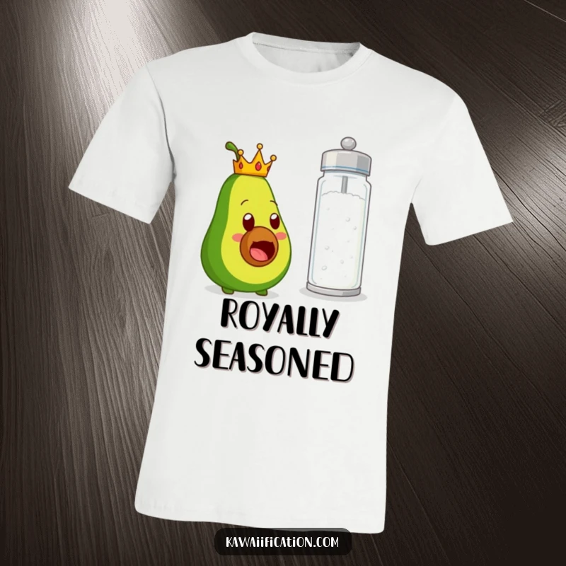Funny t-shirt with a crowned avocado character expressing wide-eyed shock at an enormous salt shaker, embodying a humorous food pairing surprise.
